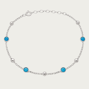 Le bracelet de station à lunette turquoise perlée